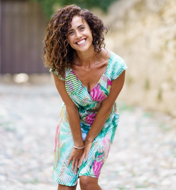 Woman posing happily on her vacation